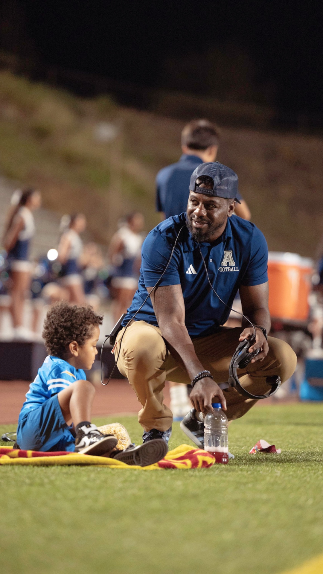 Coach Shareece Wright on the sideline at Aquinas High School